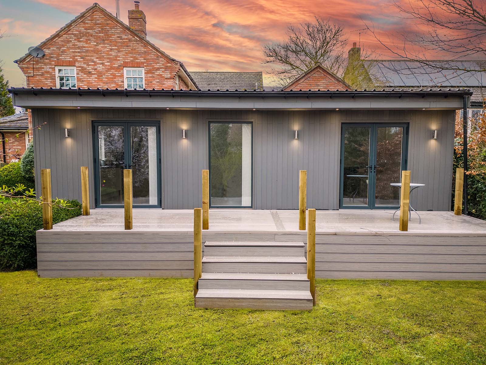 Exterior grey MALA Annexe frontage with decking
